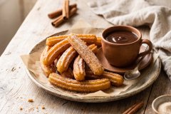 Churros_with_chocolate_served_2K_20261007114311